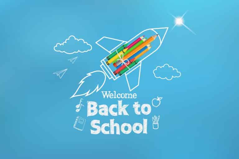 A rocket made of pencils flies in the sky and says, “welcome back to school!”