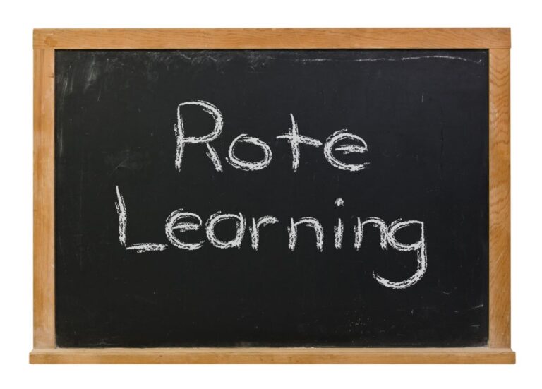 A chalkboard sign that has “rote learning” written on there.