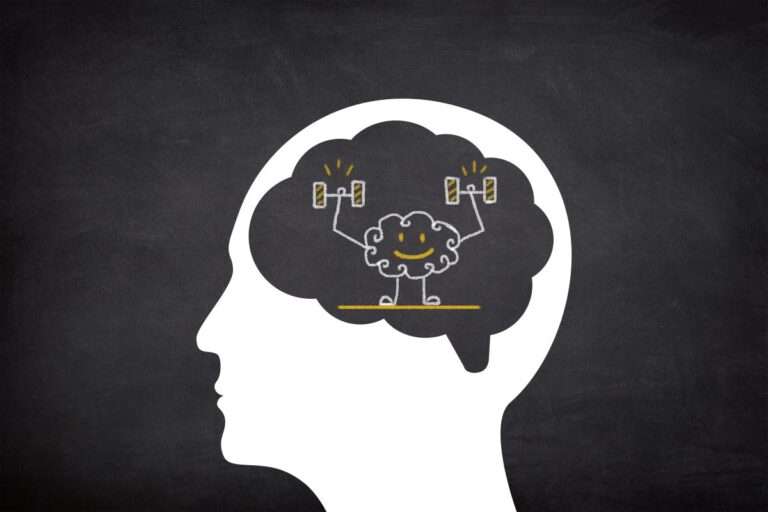 A chalkboard drawing of a human head with their brain lifting weights.